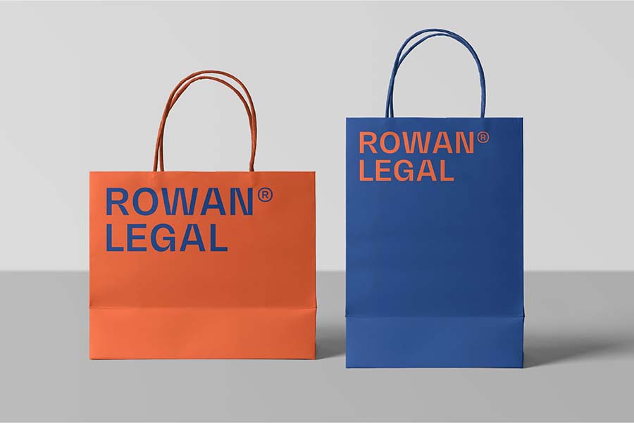 Rowan Legal paper bags mockup orange and blue